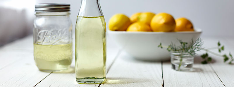 Lemon Oil with a bowl of lemons